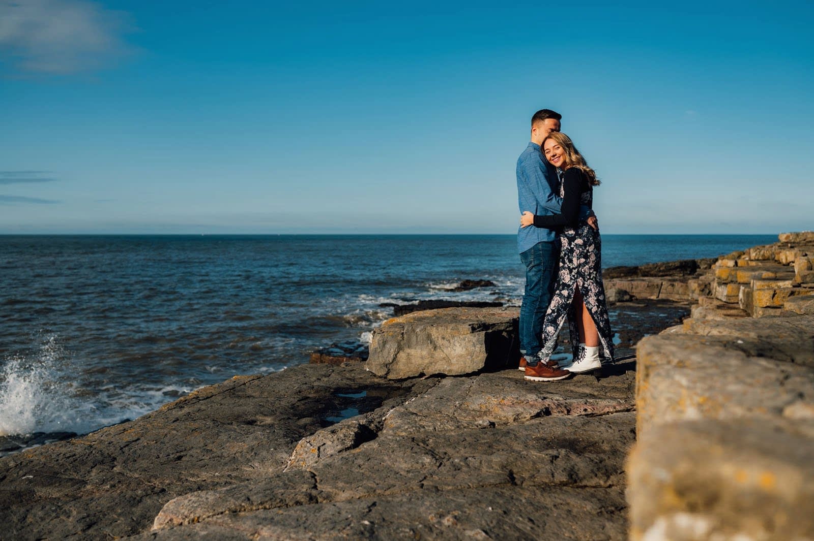 01 amy & Nathan having a cuddle near the sea